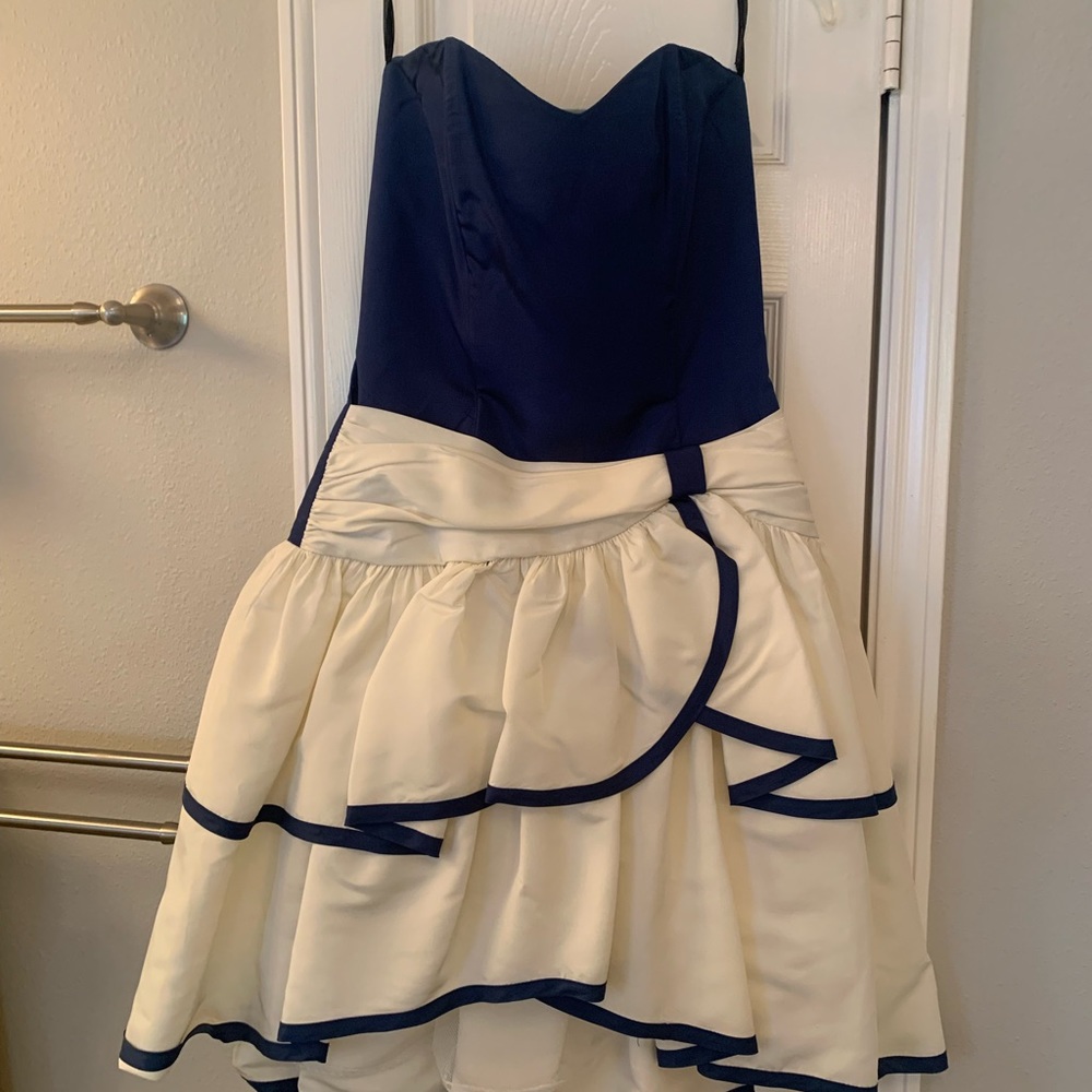 Jessica McClintock Marine blue and white cocktail dress falls just below knee.